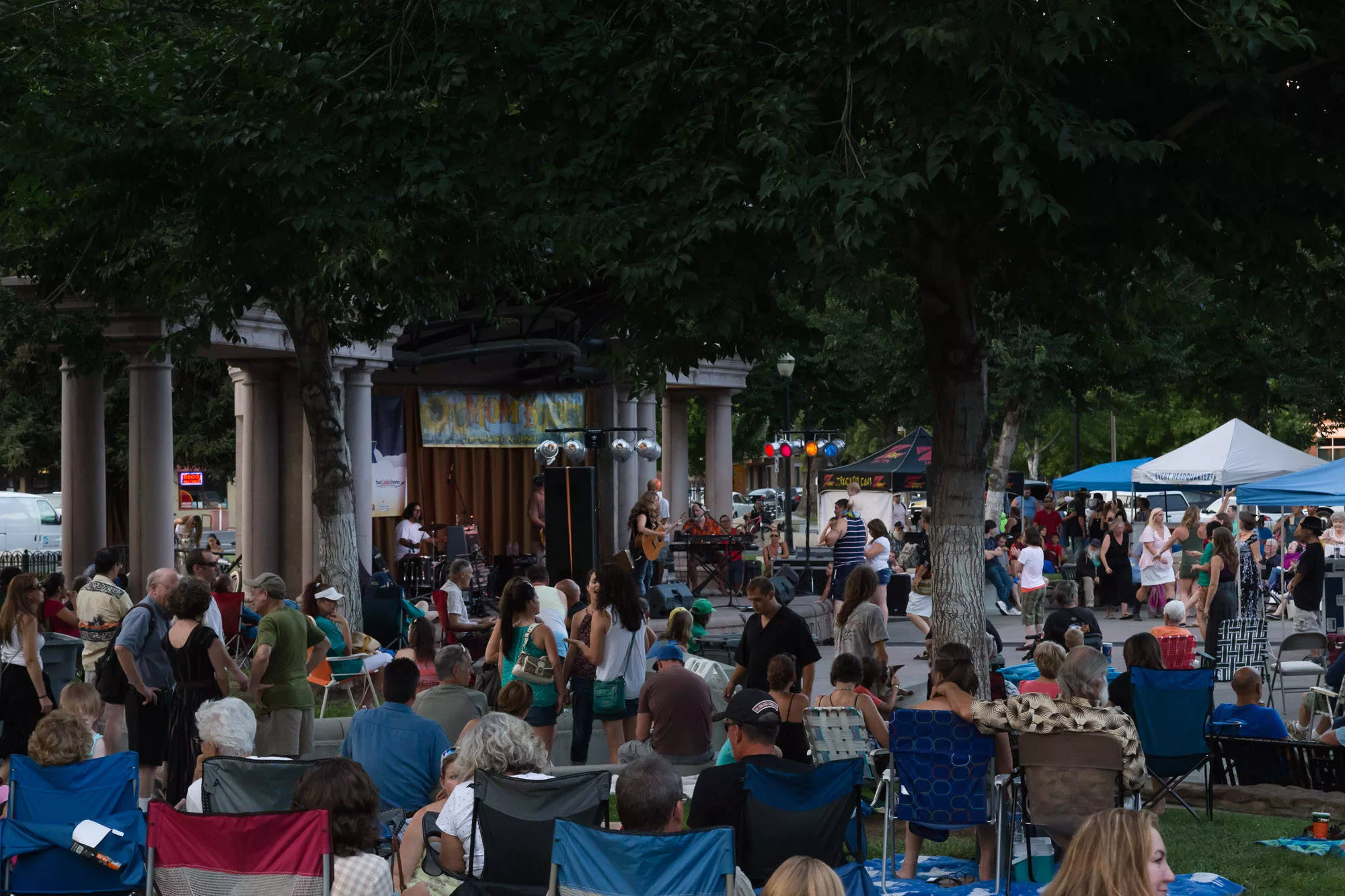 A side view of the stage from the lawn as Alli Battaglia & The Musical Brewing Co. performs during Friday Night Concerts.