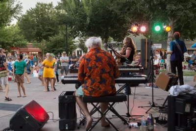 Glenn Tucker  performing with a view of the plaza as Alli Battaglia & The Musical Brewing Co. performs during Friday Night Concerts.
