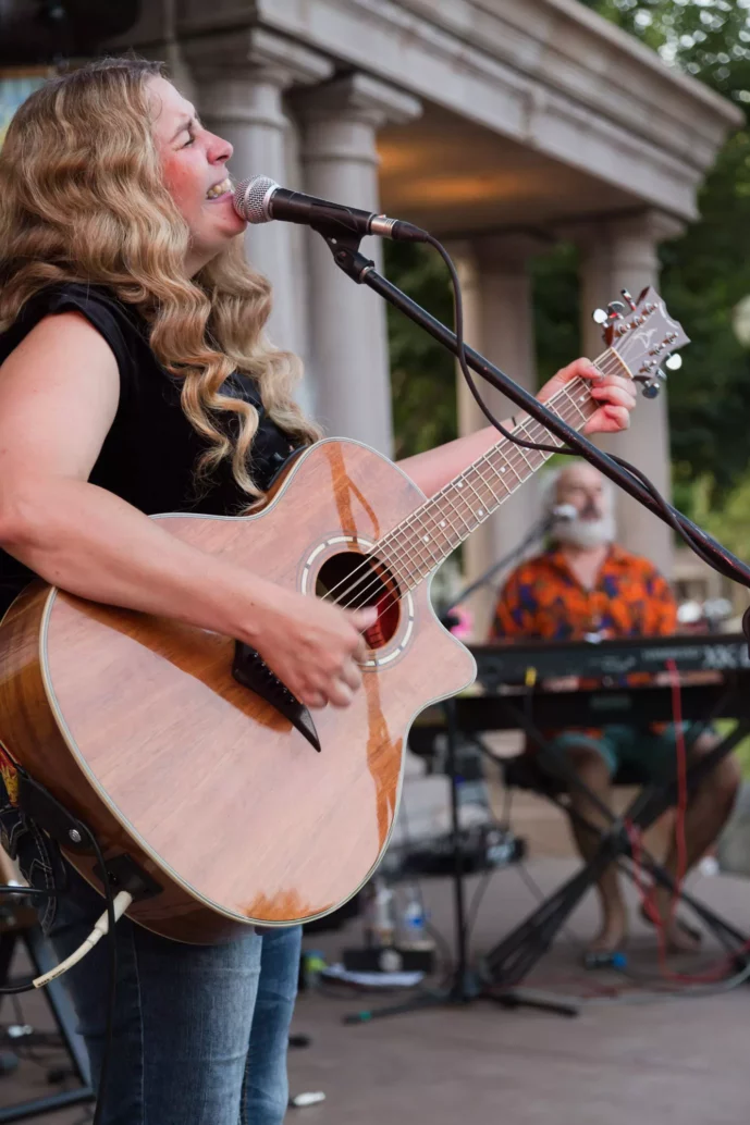 Alli Battaglia performing with her band Alli Battaglia & The Musical Brewing Co. during Friday Night Concerts.
