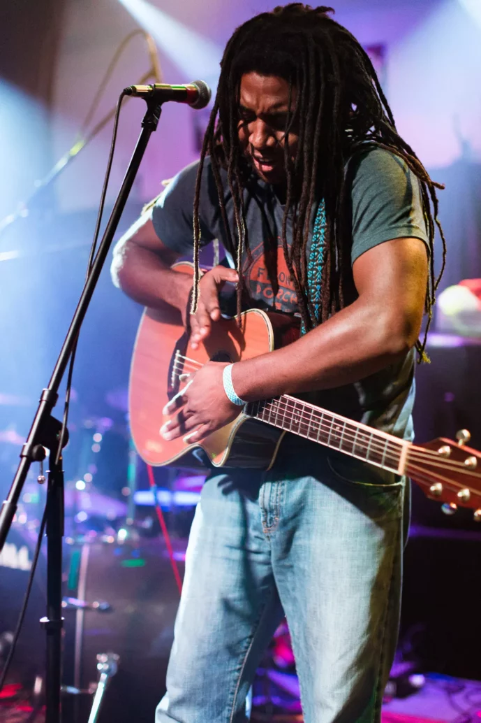 Brian Chris Rodgers catching a beat on his guitar