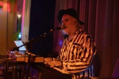 Glenn Tucker, performing on keyboards, with his band, Gravybrain at Om Foods in Chico, CA.