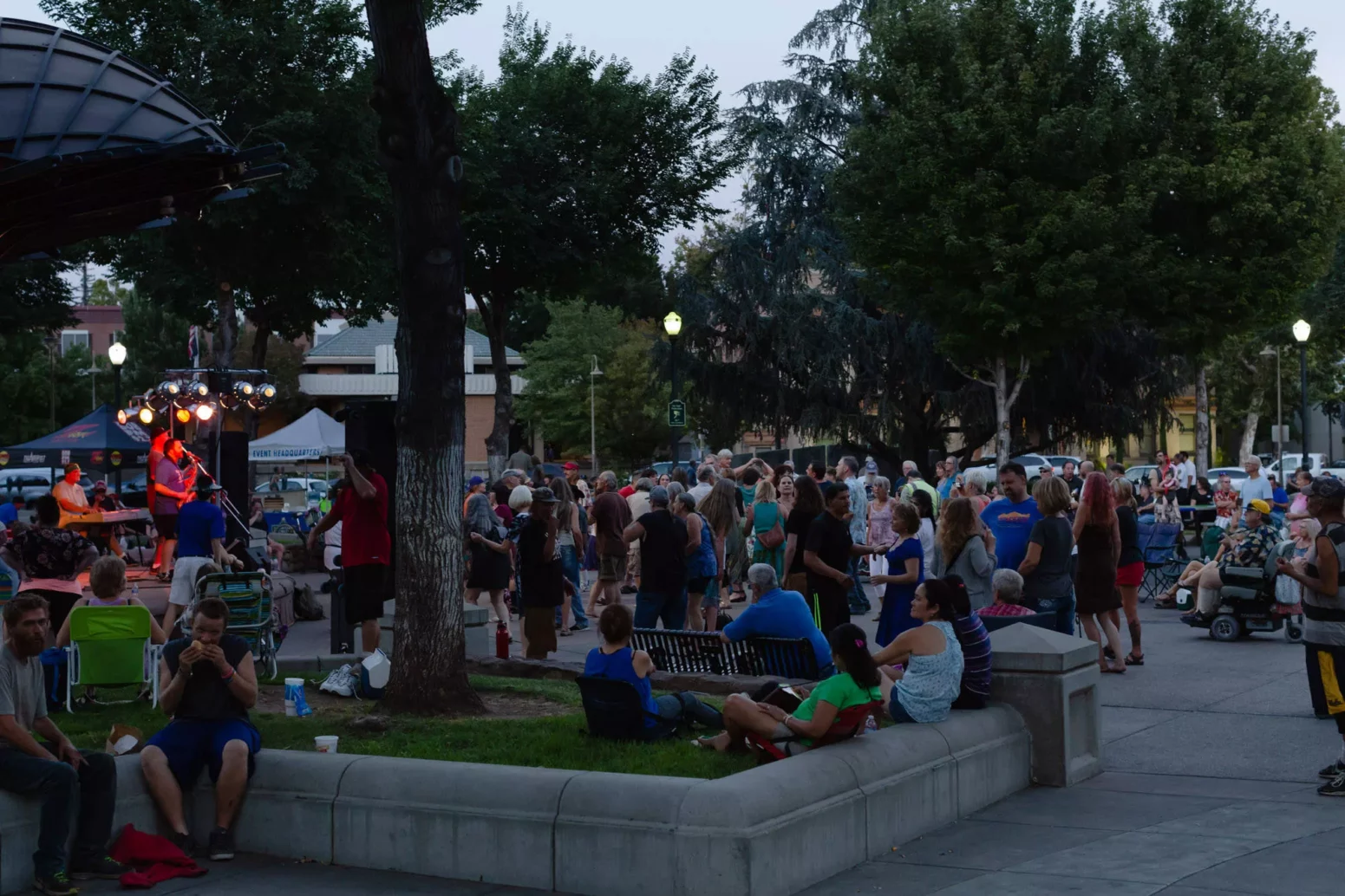 A view from an entry walkway to Plaza Park as the Jeff Pershing Band performs at Friday Night Concerts in 2018.