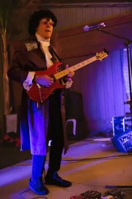 Jeff Pershing, in costume, performing on LaSalles patio during Halloween weekend, 2022.