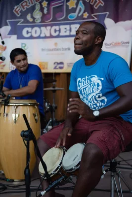 Hand drummer performing with Los Papi Chulos at Friday Night Concerts, 2014.