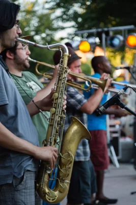 Horn section with sax featured as Los Papi Chulos performing at Friday Night Concerts, 2014.