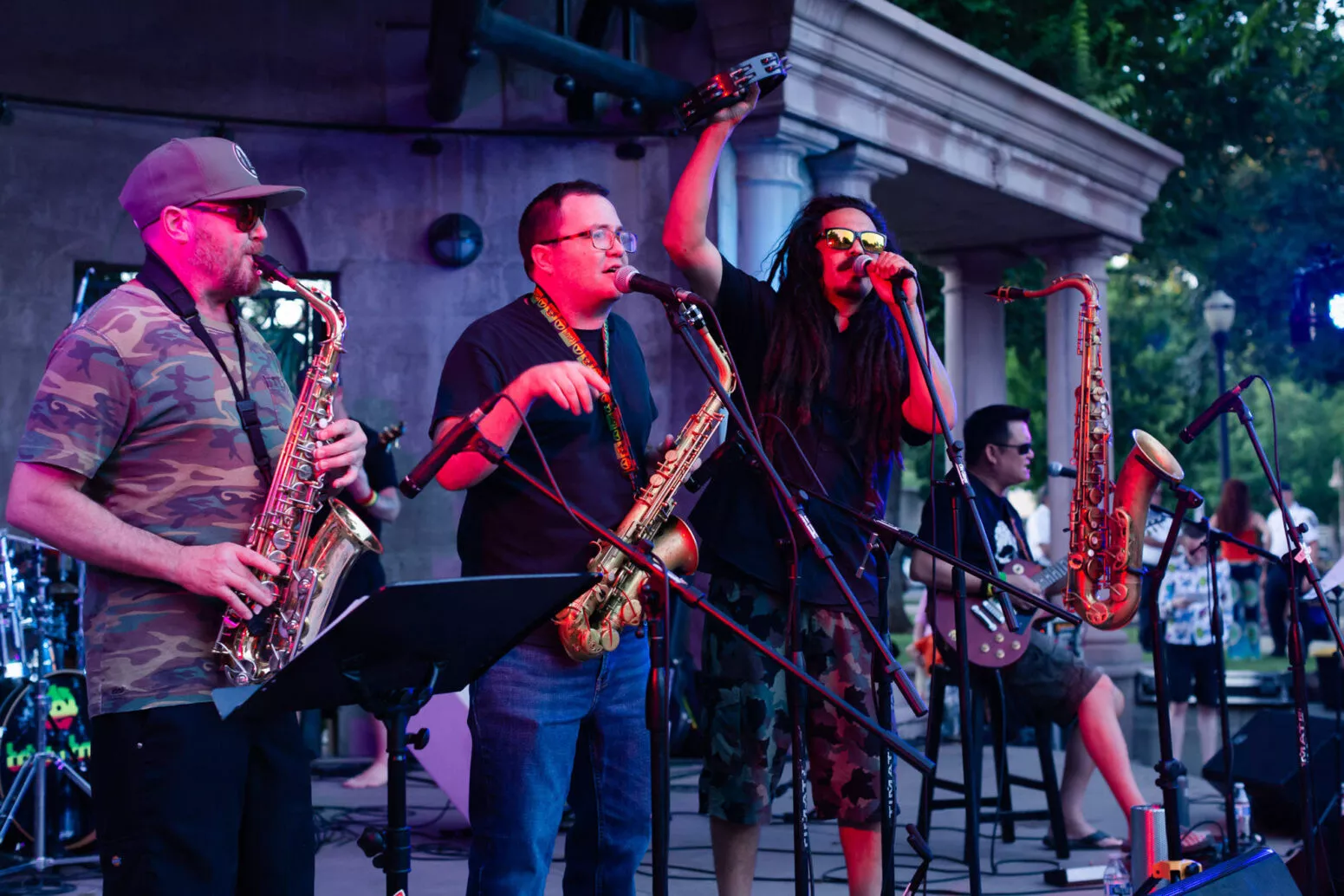 Greg Gardea sings as the horn section hits their note when Triple Tree performs in Plaza Park, Chico, CA at Friday Night Concerts, 2021.