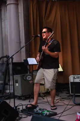 Ben Jureer on guitar as Triple Tree performs in Plaza Park, Chico, CA at Friday Night Concerts, 2021.
