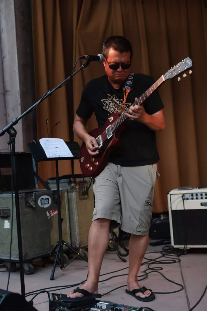 Ben Jureer on guitar as Triple Tree performs in Plaza Park, Chico, CA at Friday Night Concerts, 2021.